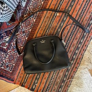 Kate Spade black crossbody with 3 pockets.